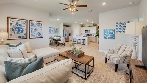 Liberty Village open concept living room furnished with farmhouse inspired decor.