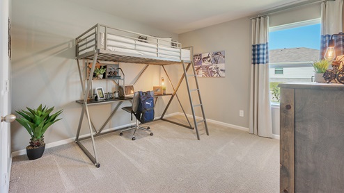 Liberty Village secondary bedroom with window, carpeted flooring, and lofted bed.