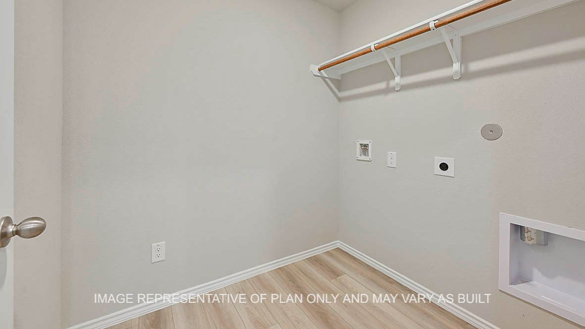 Elgin secondary utility room with vinyl plank flooring.