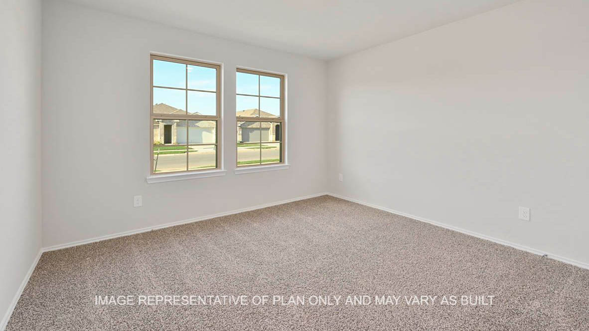 Elgin secondary bedroom with windows and carpeted flooring.