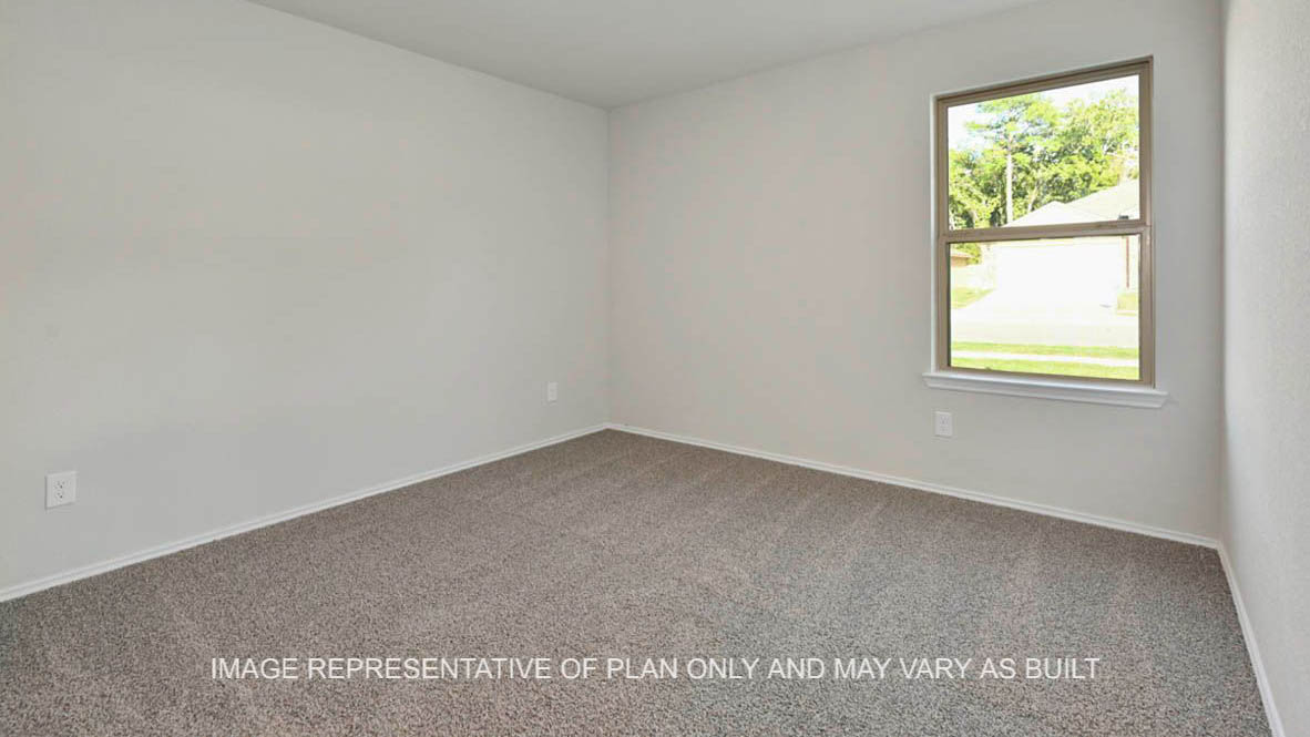 Kingston secondary bedroom with window and carpeted flooring.