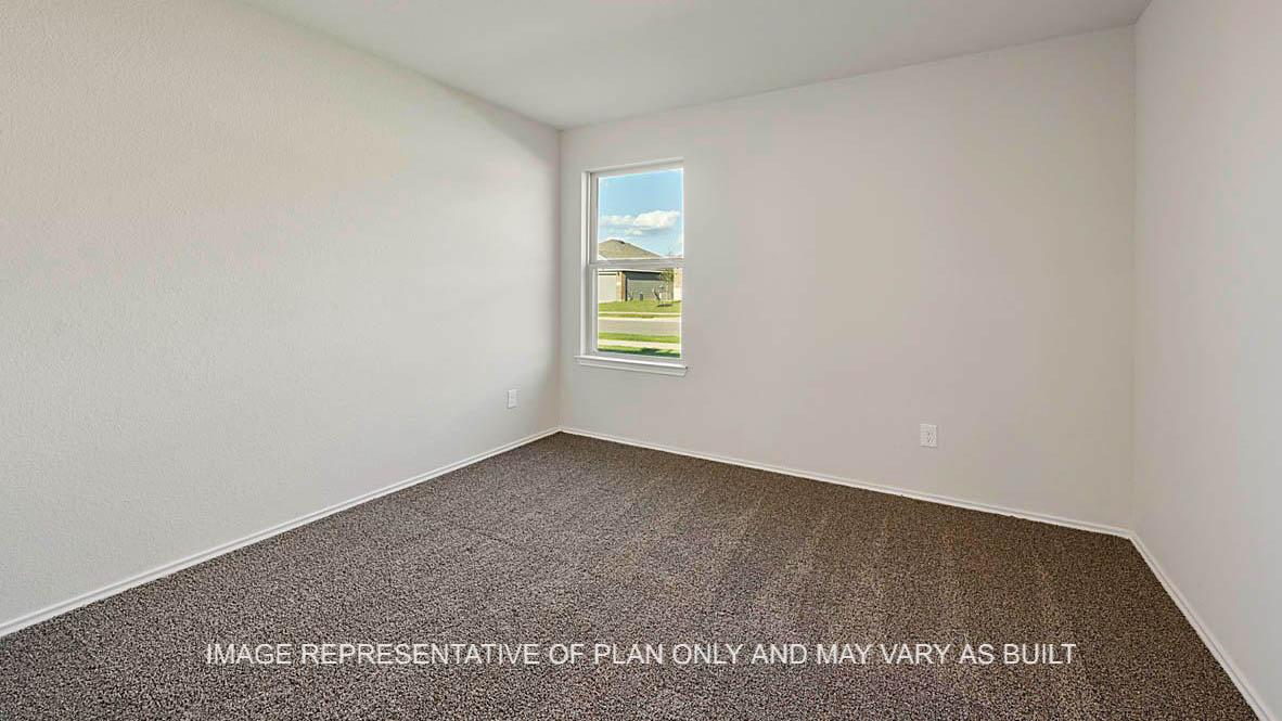 Kingston secondary bedroom with window and carpeted flooring.