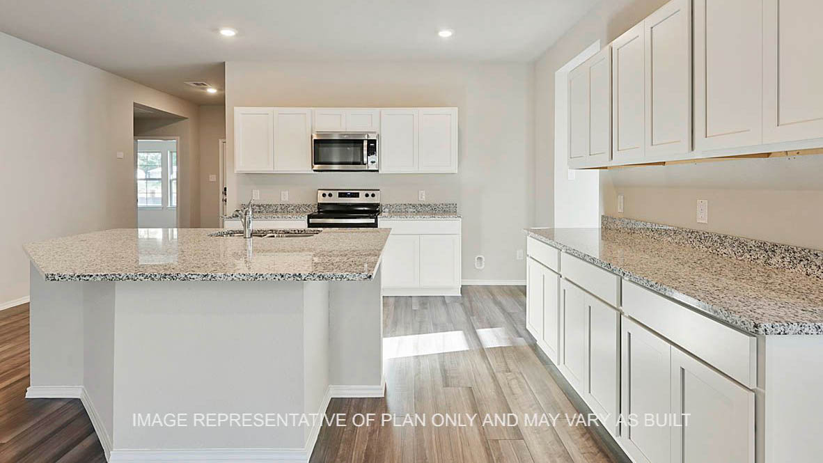 Kingston kitchen with view to entryway white cabinetry, granite countertops, kitchen island and vinyl plank flooring.