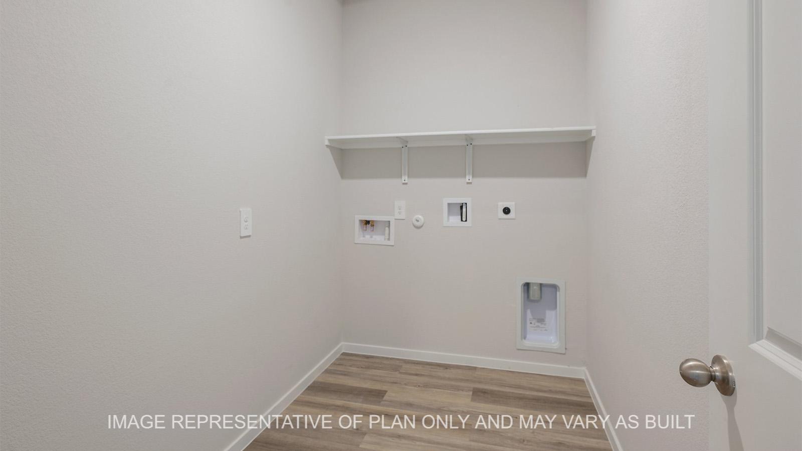 Midland utility room with vinyl plank flooring.