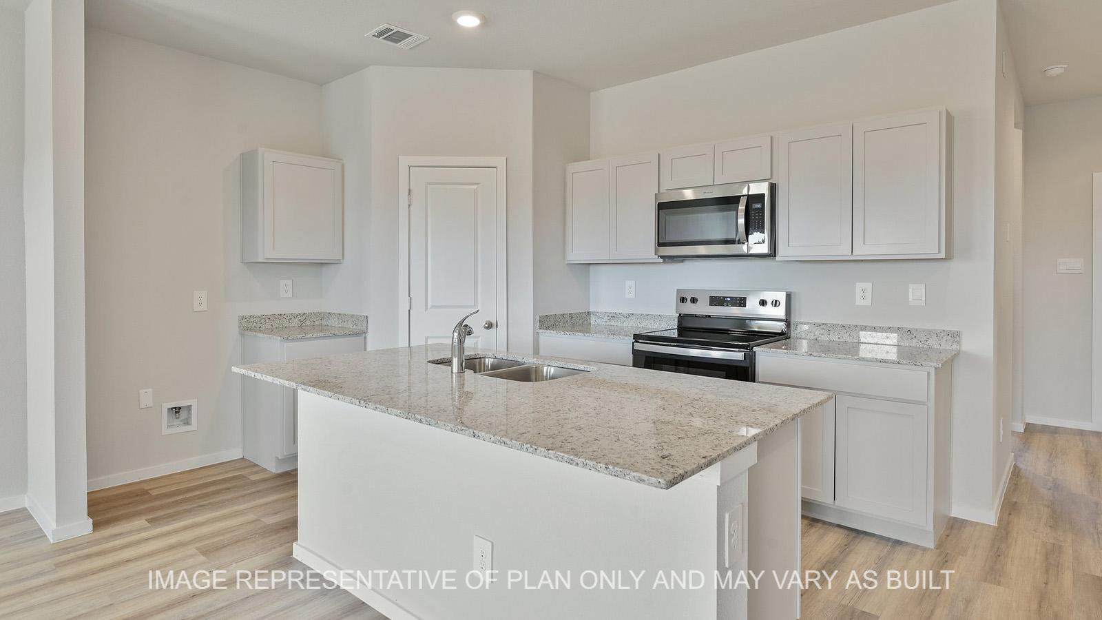 Midland kitchen with gray cabinetry, granite countertops, and vinyl plank flooring.