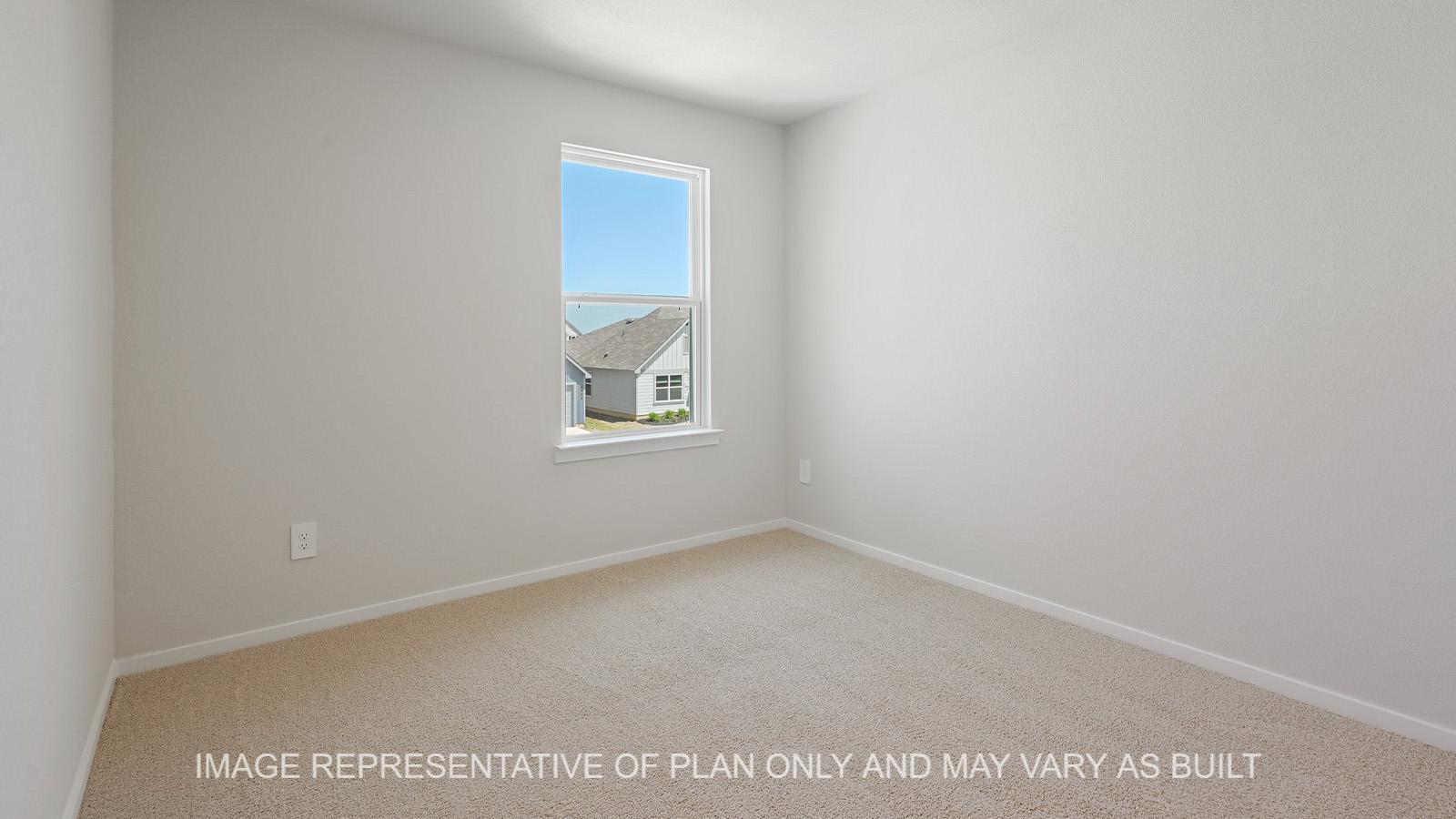 Midland secondary bedroom with window and carpeted flooring.