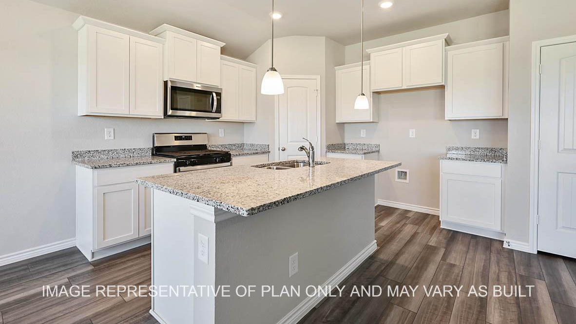 Auburn kitchen with white cabinets, granite countertops and vinyl plank flooring.