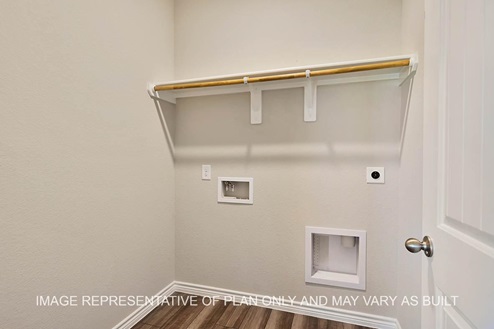 Auburn utility room with vinyl plank flooring.