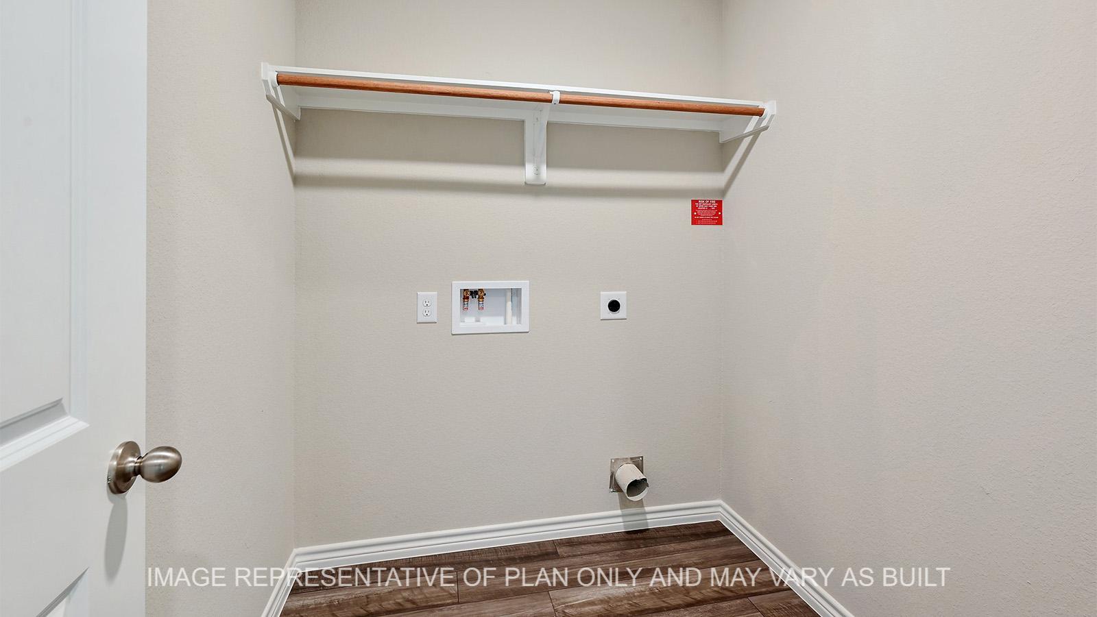 Alpine utility room with viny plank flooring.