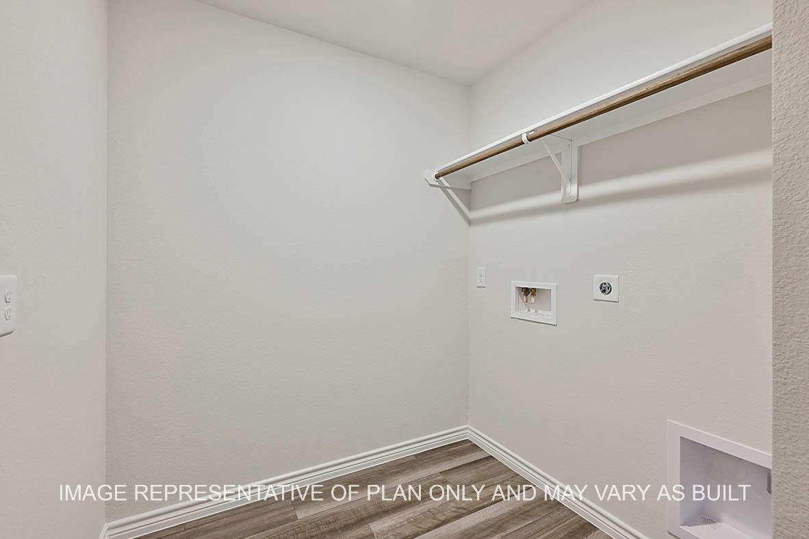 Roosevelt utility room with gray vinyl plank flooring.