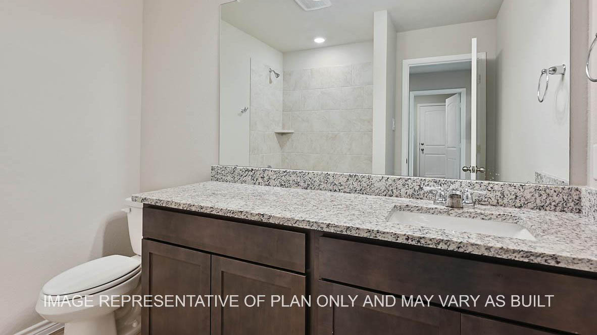 Richmond secondary bathroom with  dark cabinets, granite countertops, ceramic tile shower surround and vinyl plank flooring.