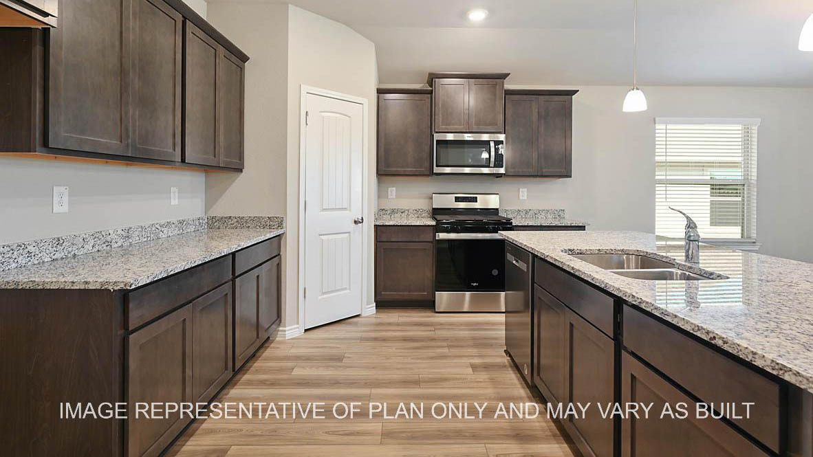 Richmond kitchen with dark cabinets, granite countertops and vinyl plank flooring.