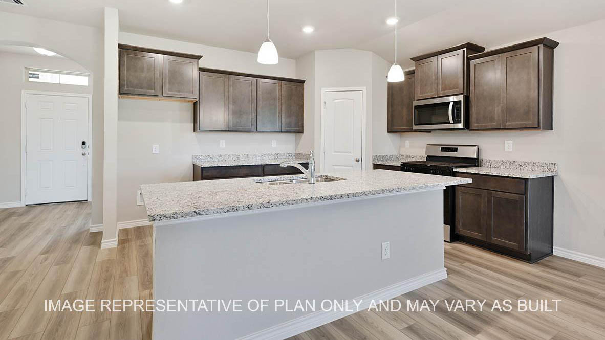 Richmond kitchen with dark cabinets, granite countertops and vinyl plank flooring.