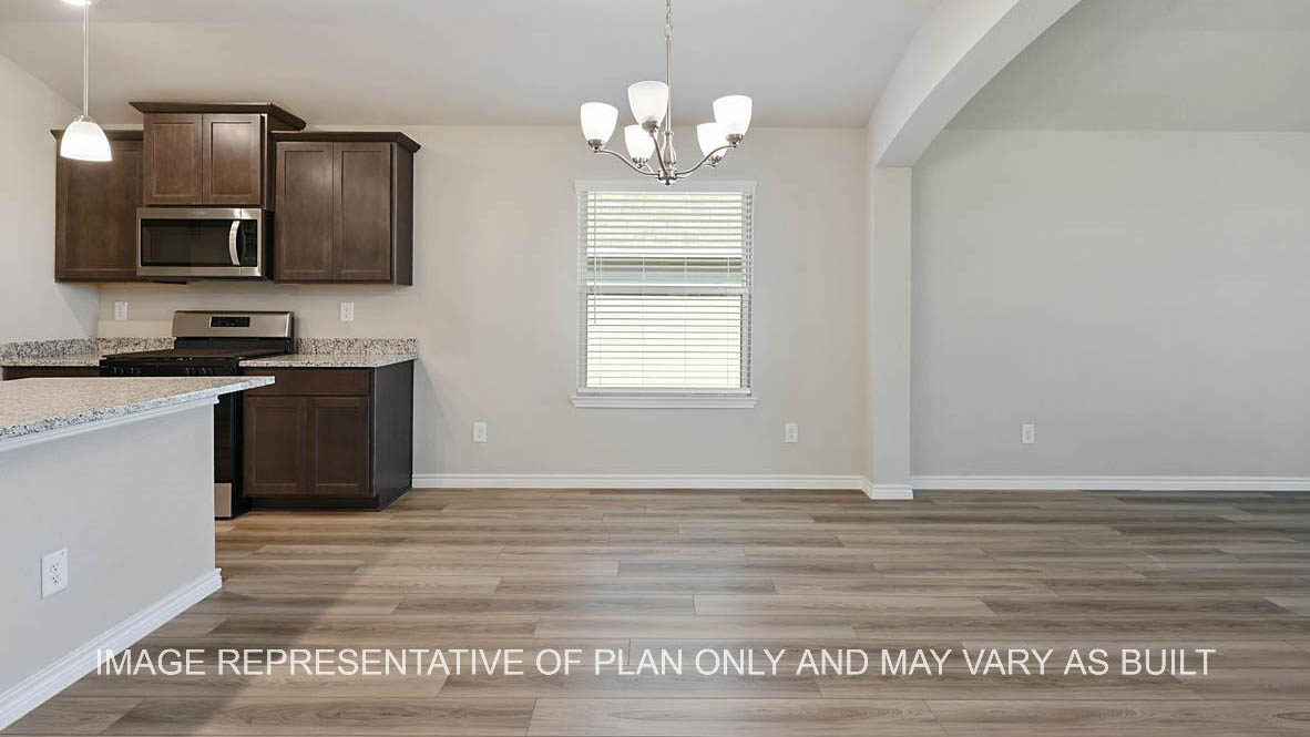 Richmond dining room and open concept kitchen with view to living room and vinyl plank flooring.