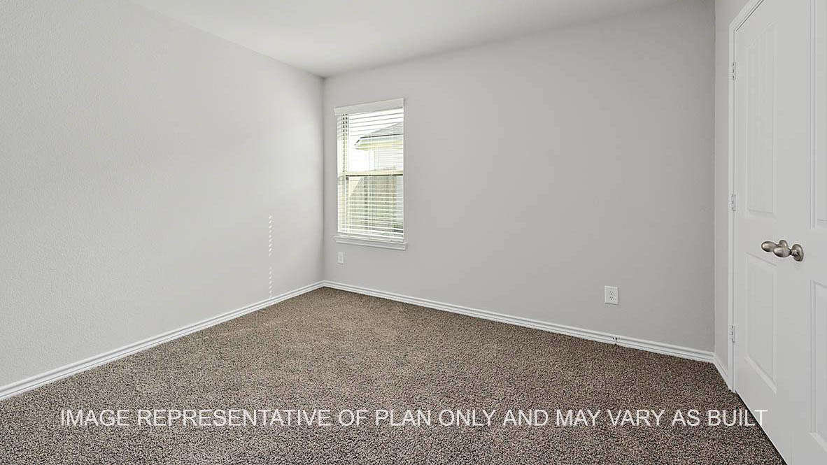 Prescott secondary bedroom with window and carpet flooring.