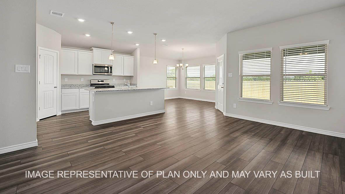 Prescott living room and open concept kitchen with view to dining room and vinyl plank flooring.