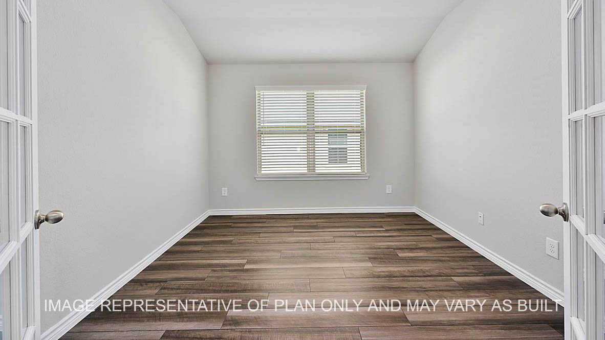 Prescott optional study with window, vinyl plank flooring, and french double doors.