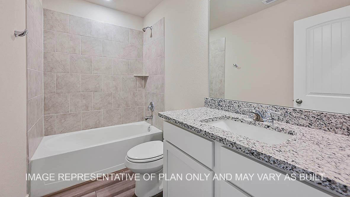 Prescott secondary bathroom with white cabinets, granite countertops, ceramic tile shower surround and vinyl plank flooring.