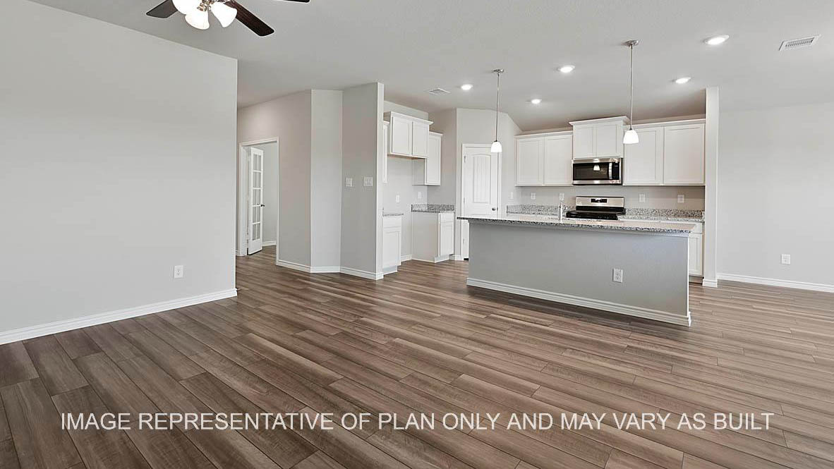 Prescott living room with view to kitchen and vinyl plank flooring.