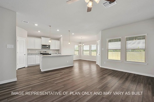 Prescott living room and open concept kitchen with view to dining room and vinyl plank flooring.