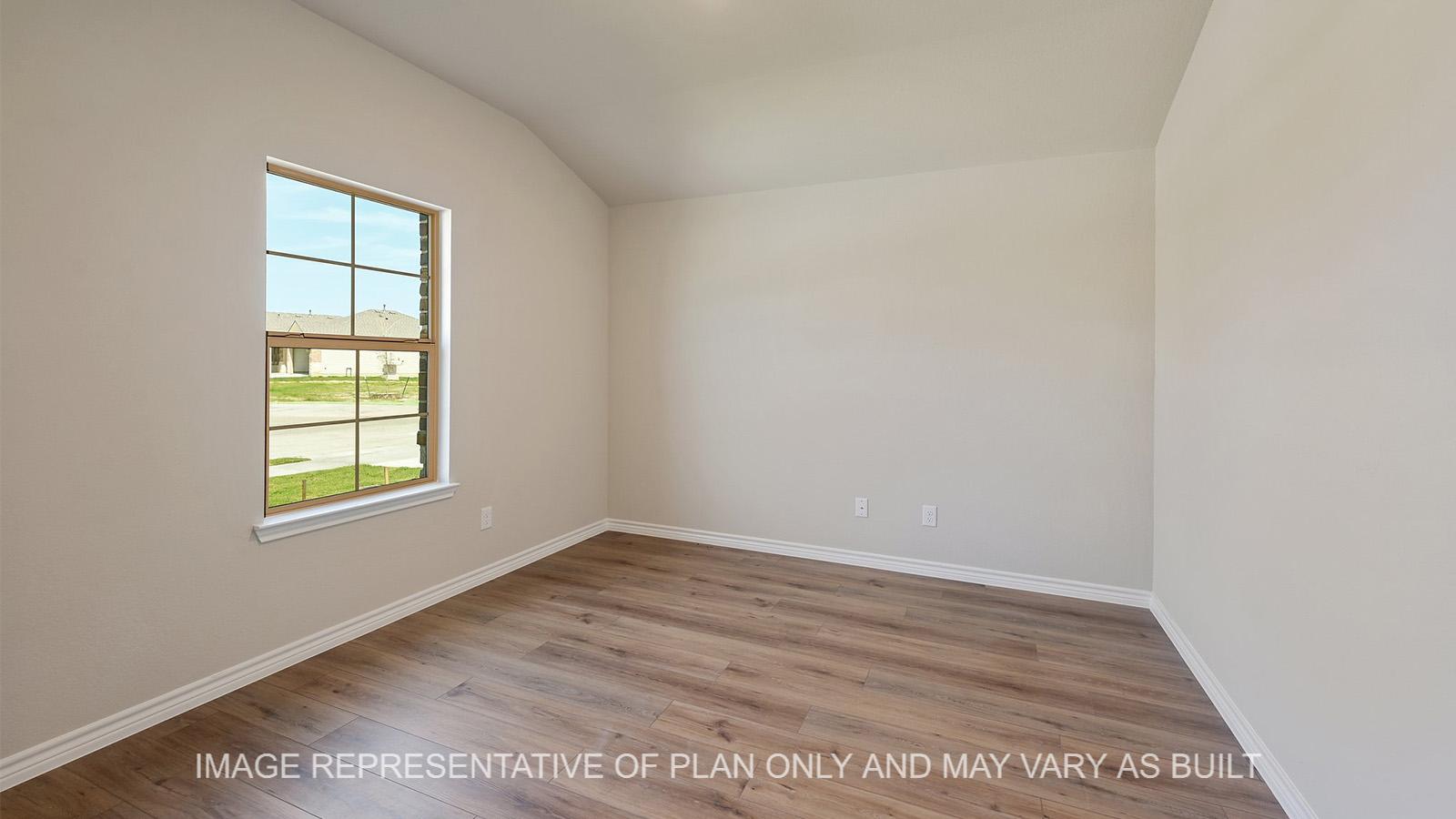 Everett dining room with window and vinyl plank flooring.
