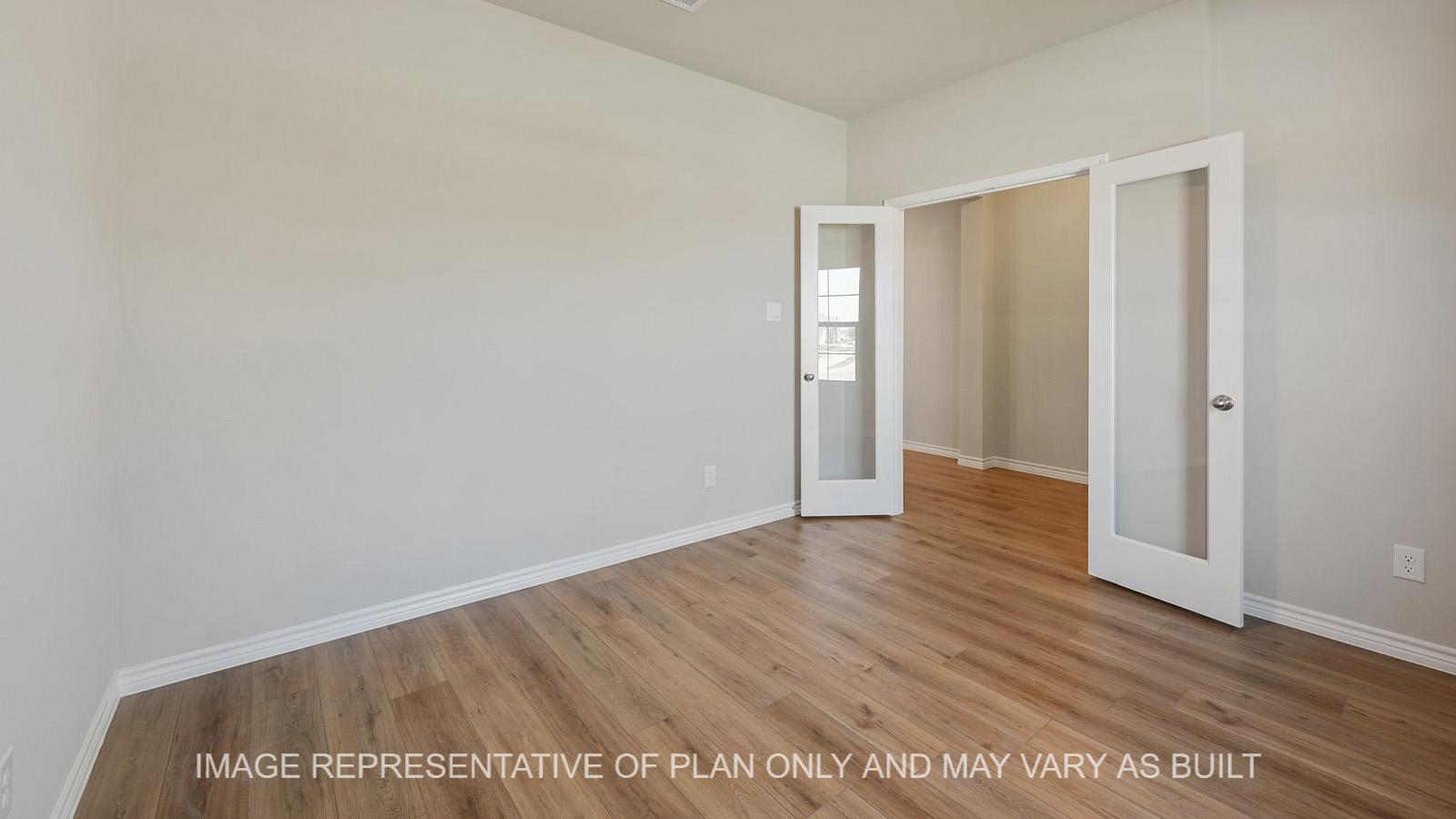 Everett dining room with french doors and vinyl plank flooring.