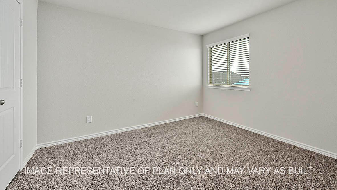 Sonoma secondary bedroom with window and carpet flooring.