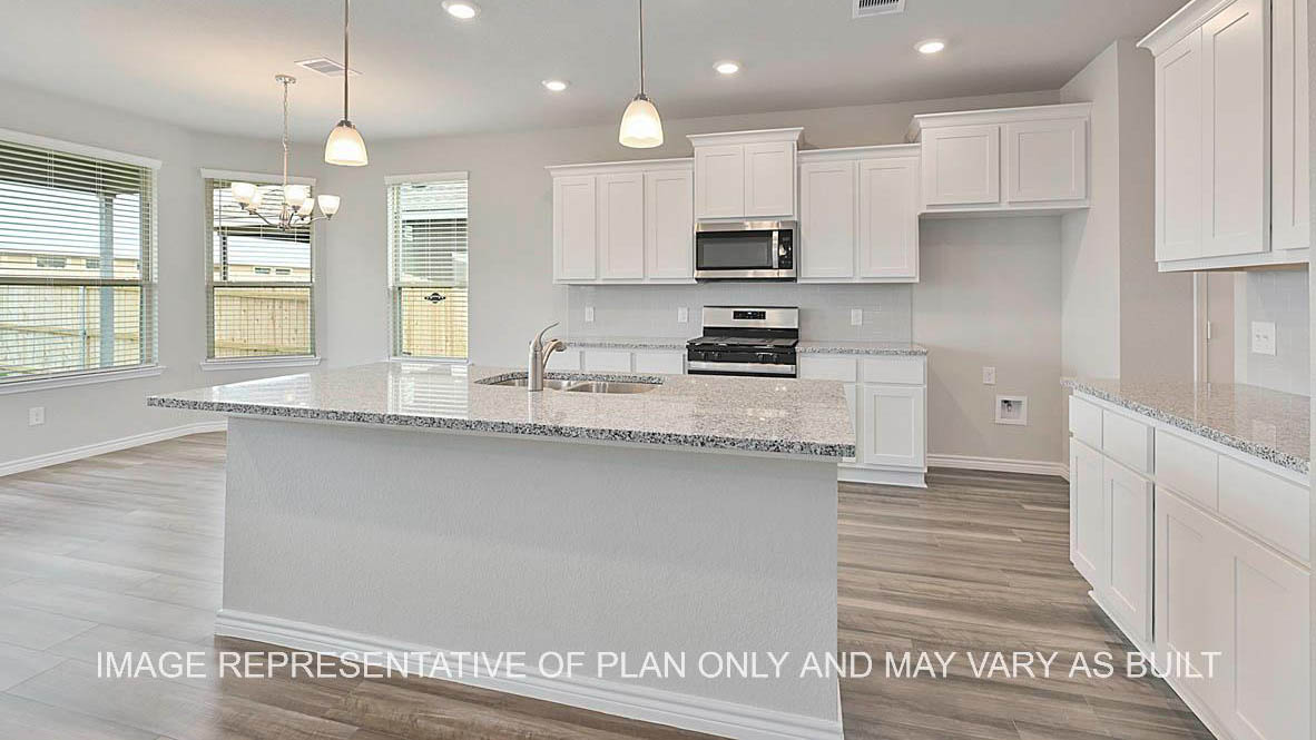 Sonoma kitchen with white cabinets, granite countertops and vinyl plank flooring.