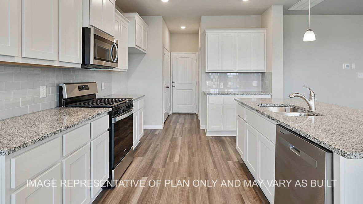 Sonoma kitchen with white cabinets, granite countertops and vinyl plank flooring.