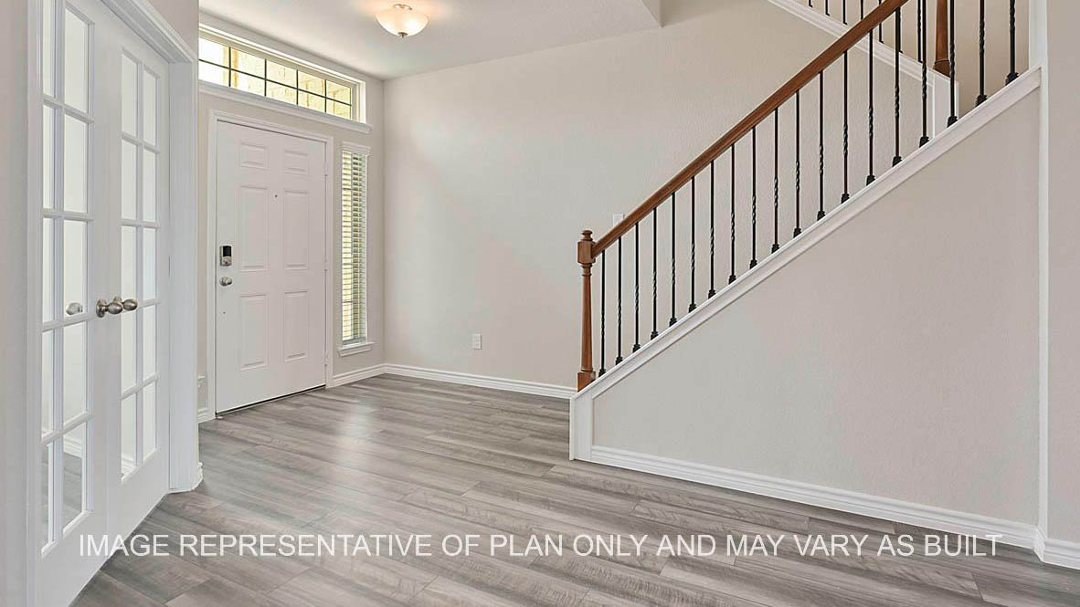 Kiawa entry with gray laminate flooring and view of study and stairs.