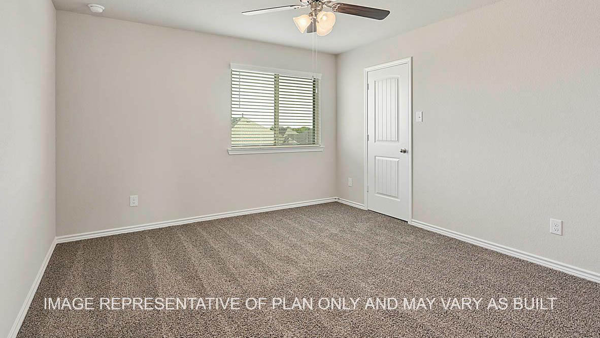 Kiawa secondary bedroom with window, carpeted flooring, and view to closet.