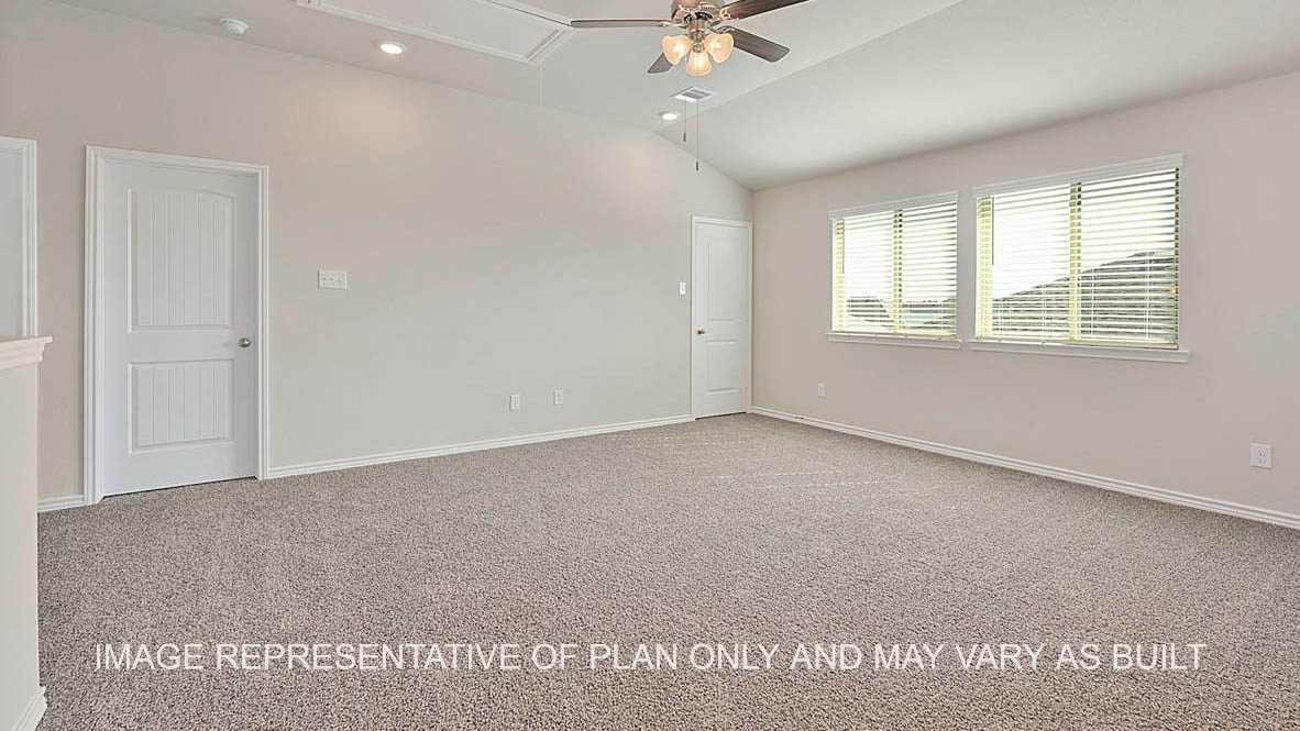Kiawa gameroom with windows and carpeted flooring.