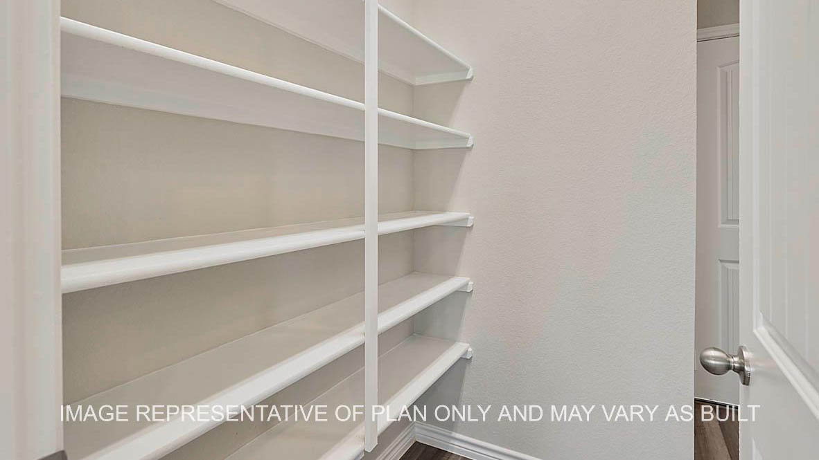 Kiawa pantry with shelving and laminate flooring.