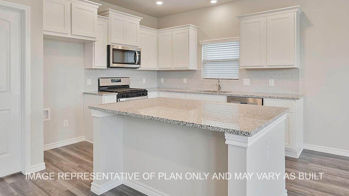 Kiawa kitchen with white cabinetry, granite countertops, tile backsplash, and kitchen island.