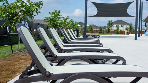 Southern Pointe pool deck with lounge chairs