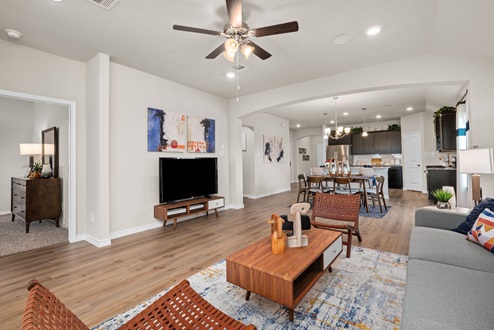 Southern Pointe model home open-concept living room with view to kitchen