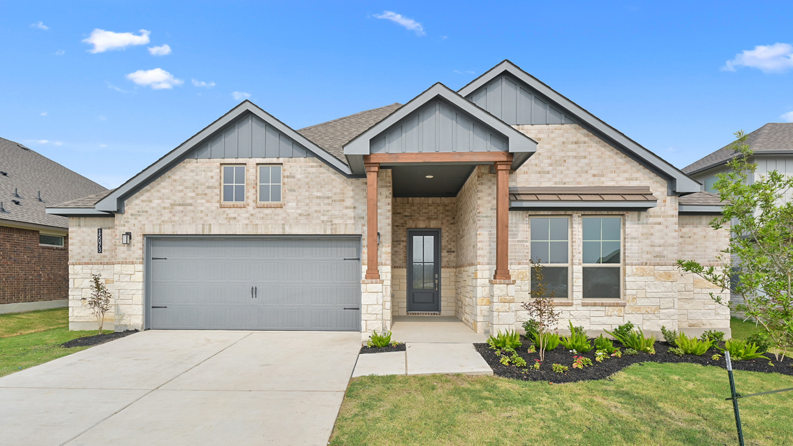Oxford one-story home with brick and stone masonry.