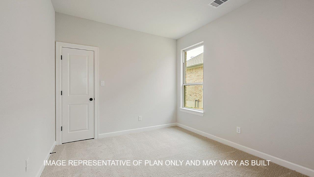 Brighton secondary bedroom with carpet and windows.