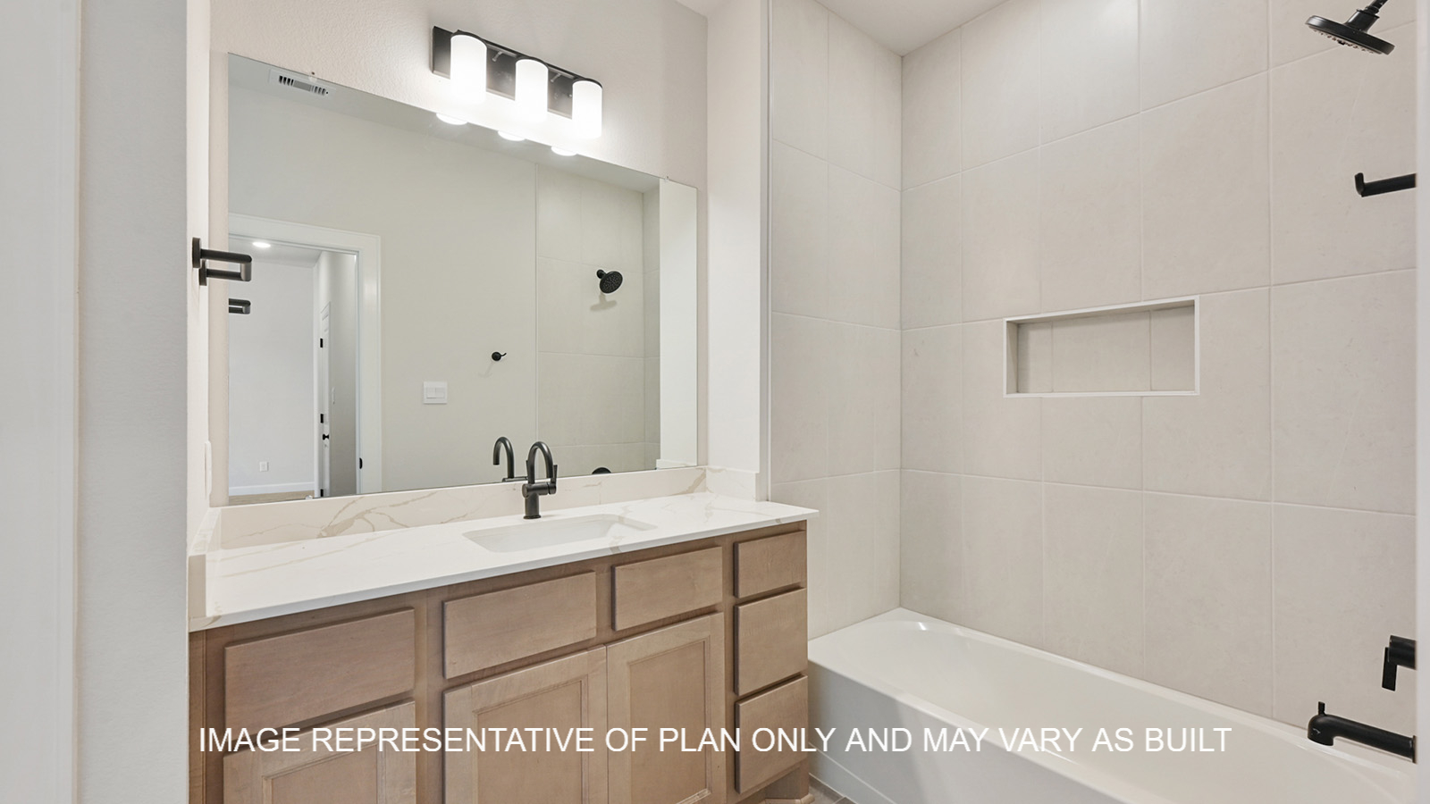 Brighton secondary bathroom with light stained cabinets, white quartz countertops and matte black fixtures.