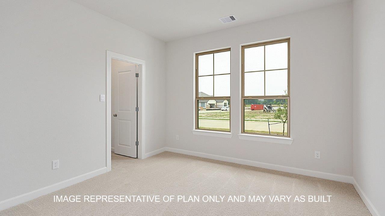 Oxford secondary bedroom with carpet and windows.