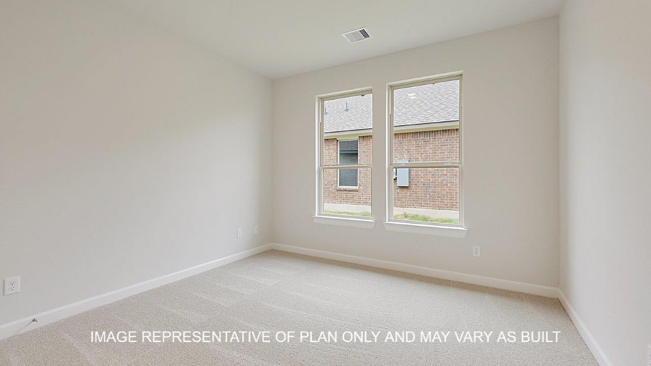 Oxford secondary bedroom with carpet and windows.