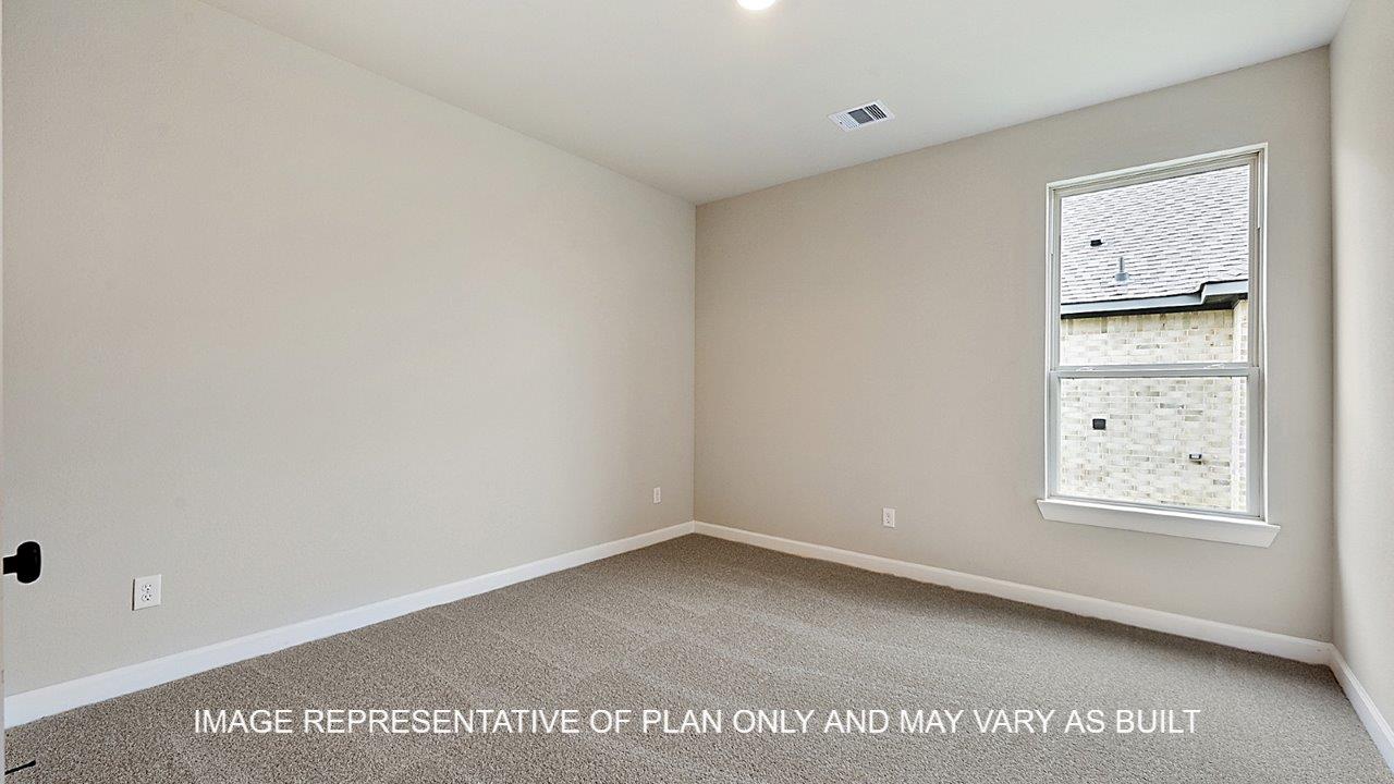 Stratford secondary bedroom with carpet and windows.
