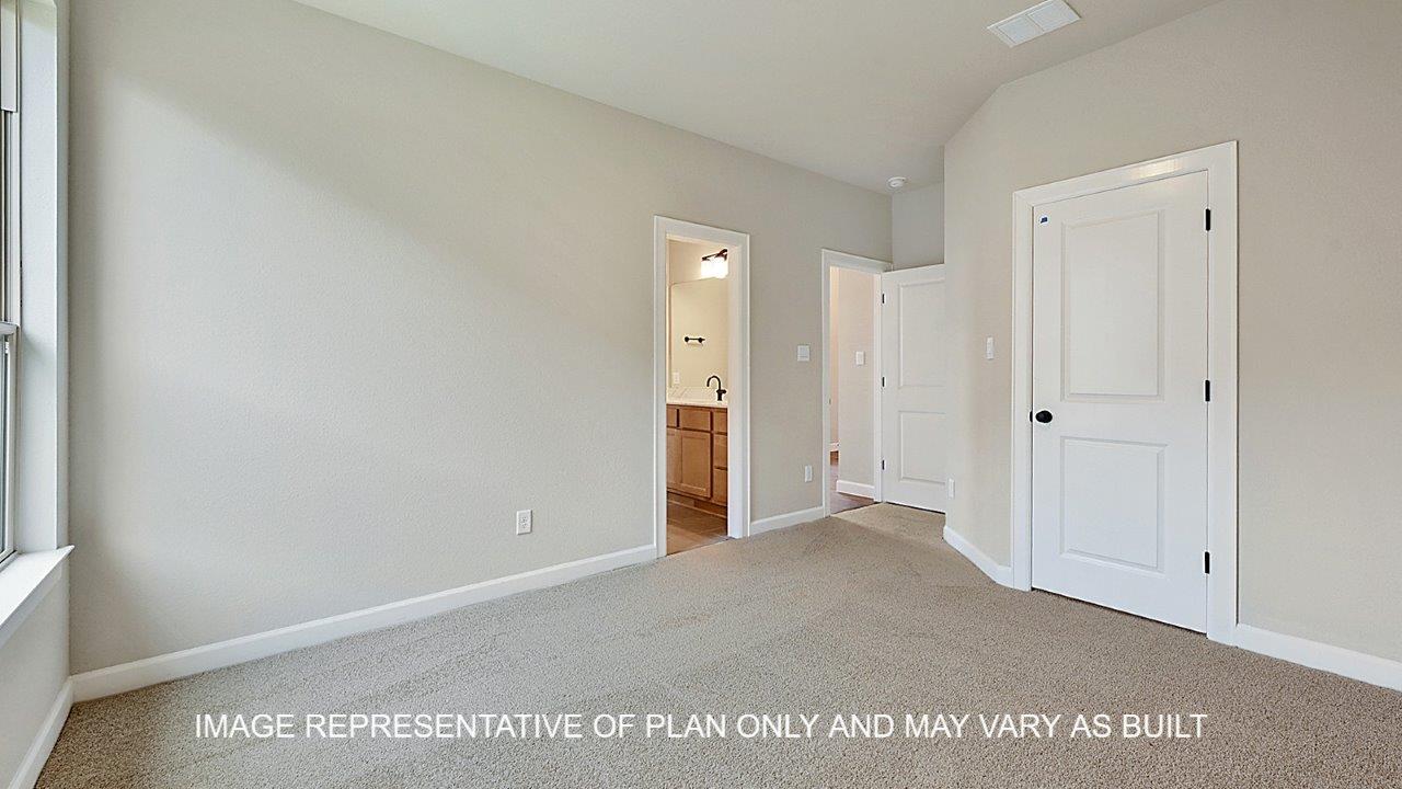 Stratford secondary bedroom with carpet and windows.
