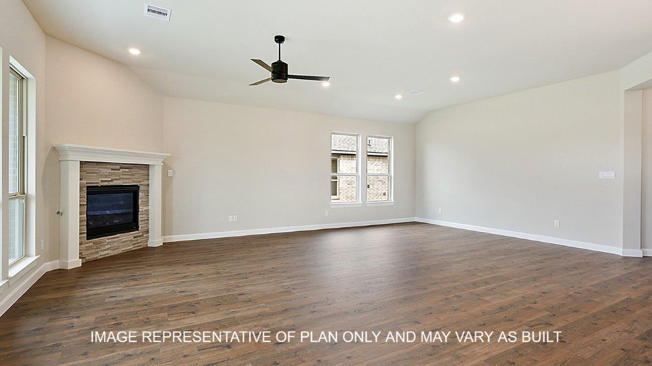Stratford living room with dark laminate wood flooring and corner fireplace.