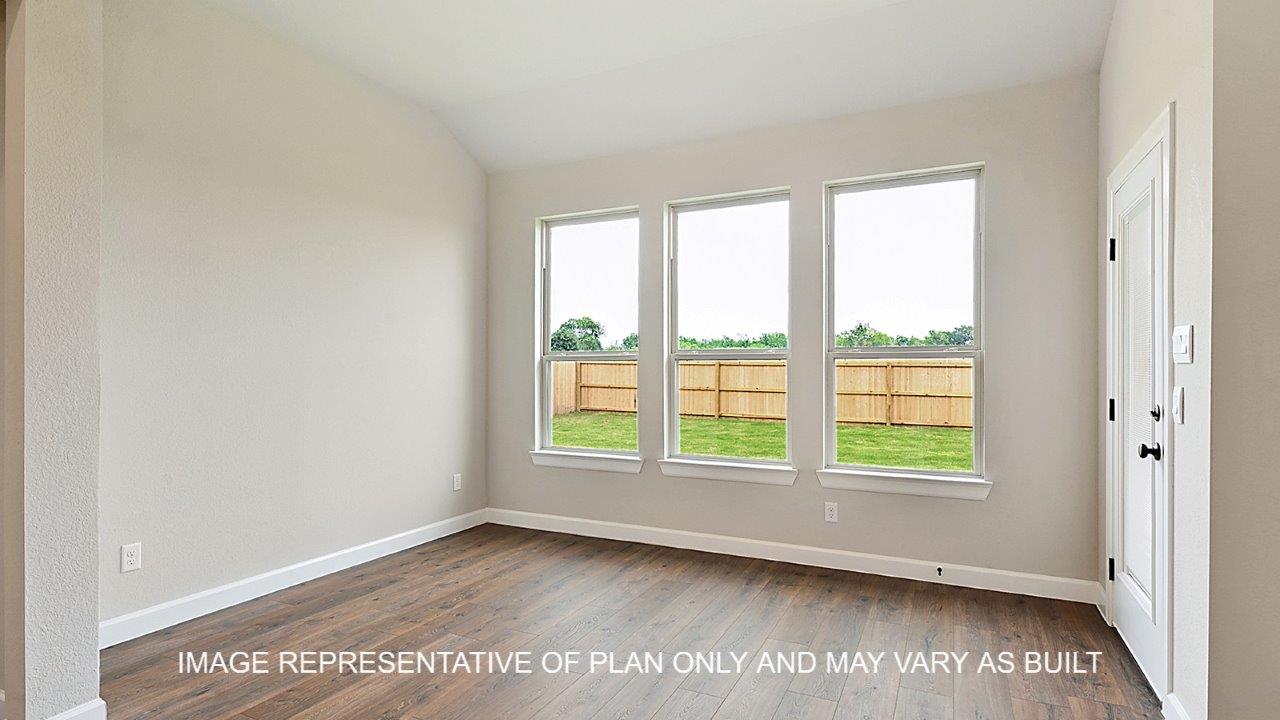 Stratford study with dark laminate wood flooring and window.