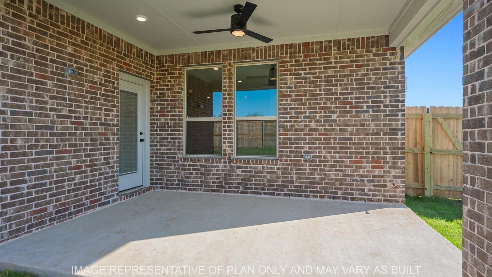 Weston covered patio with ceiling ffan and brick surround.
