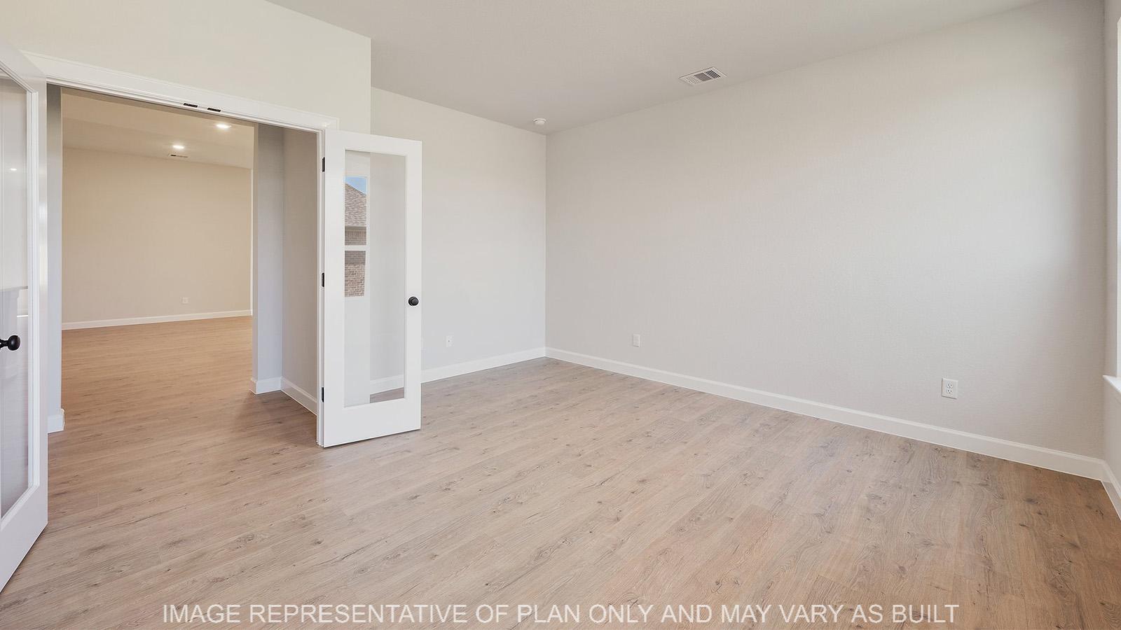 Weston study with laminate flooring and glass french doors.
