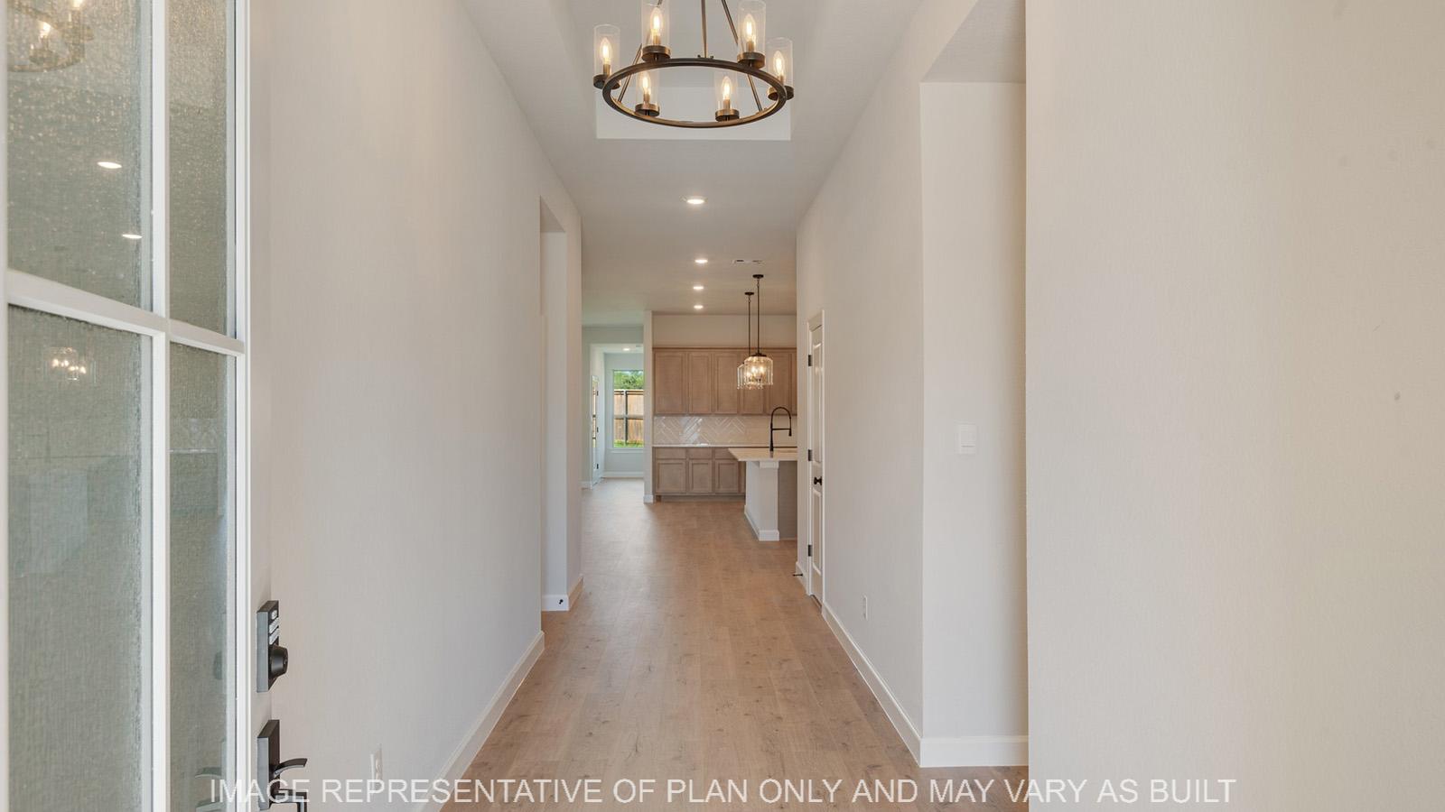 Weston entry with laminate flooring and view to the kitchen.