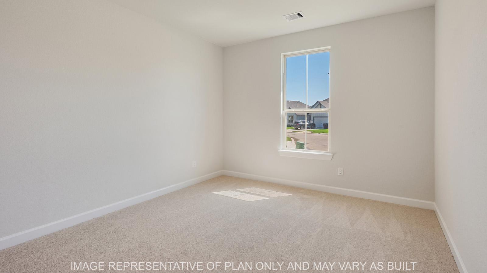 Weston secondary bedroom with carpeted flooring and window.