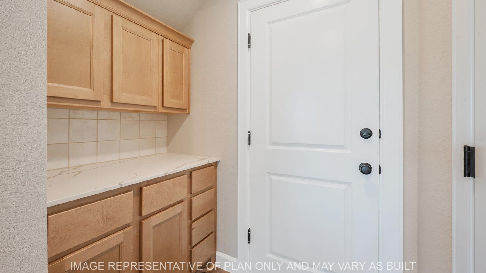 Norwood butlers pantry with garage access.